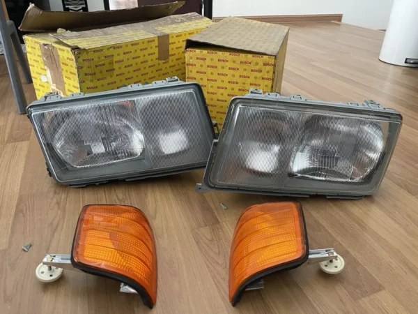 NOS BOSCH Mercedes-Benz W201 Euro 190E HEADLIGHTS PAIR WITHOUT REFLECTIVE CHROME